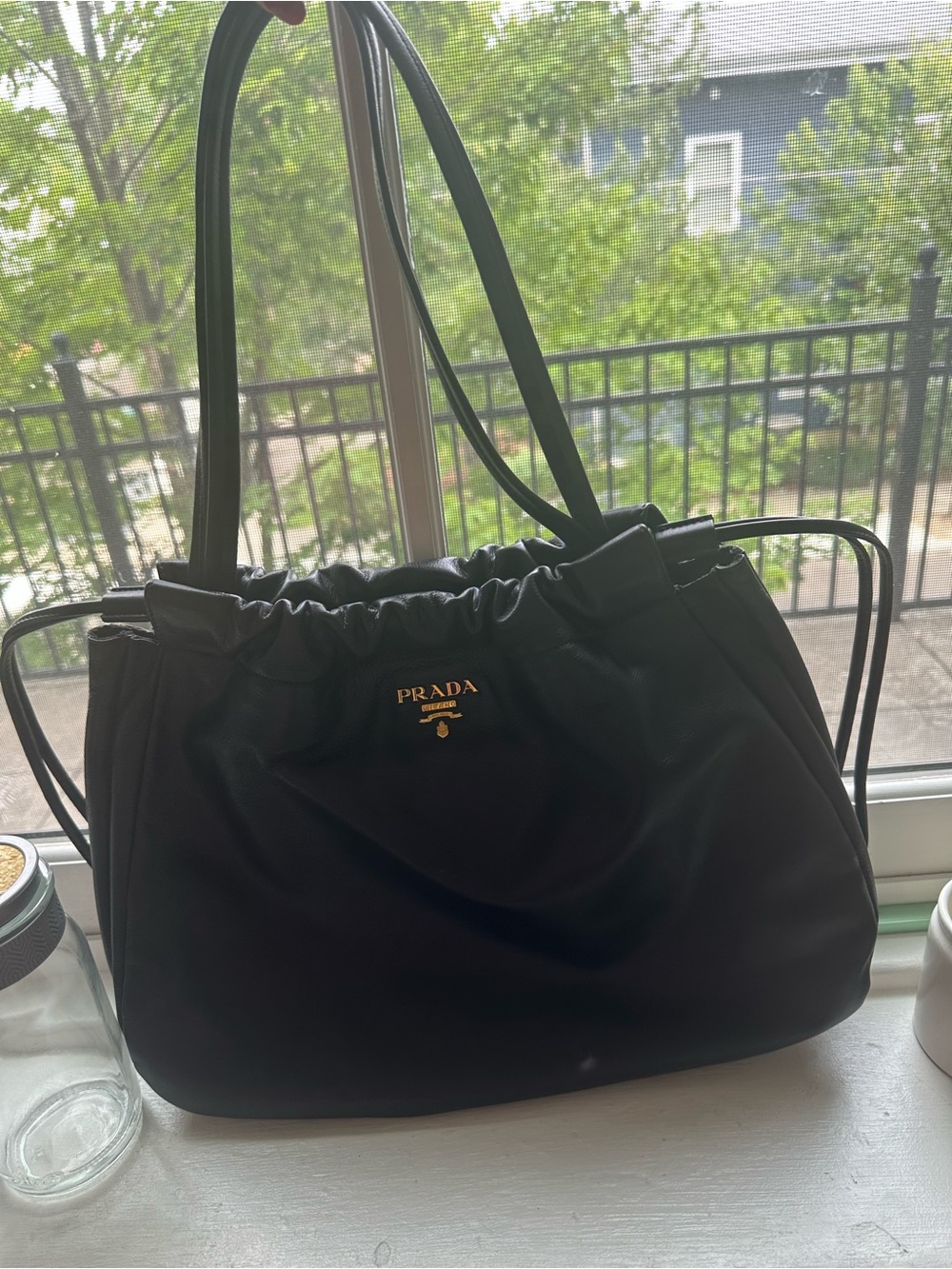 Prada Black Leather Drawstring Shoulder Bag with Gold Logo